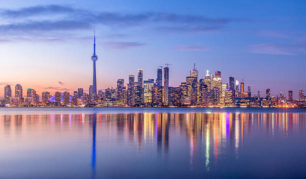 Toronto skyline at twilight reflected in Lake Ontario